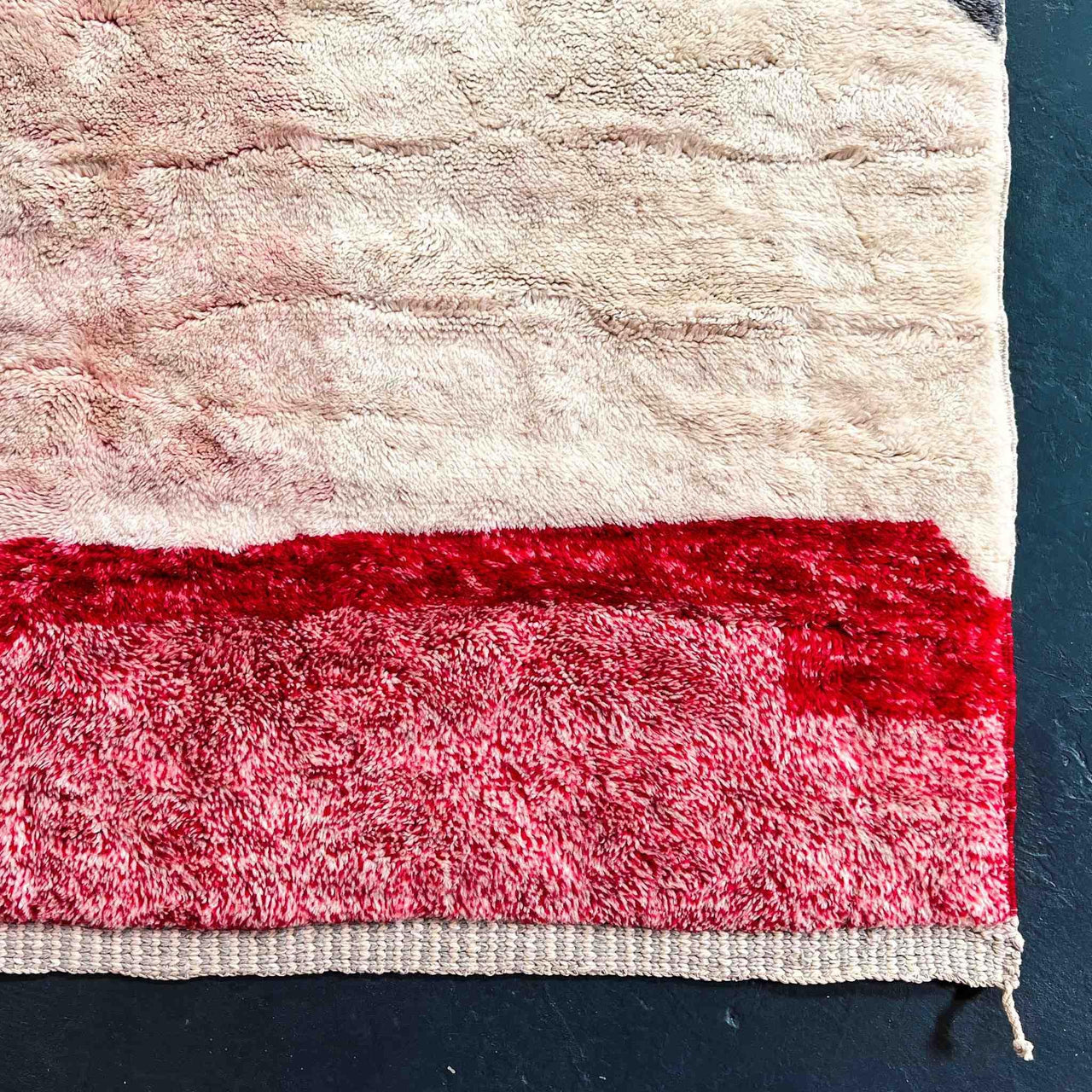 Add a touch of elegance to your home with the Rosy Abstract Handwoven 100% Wool Beni Mrirt Rug, a classic Beni Ourain rug measuring 8.1 X 9.9 ft / 247 X 304 cm. This handcrafted rug features a beautiful abstract design and luxurious wool texture.
